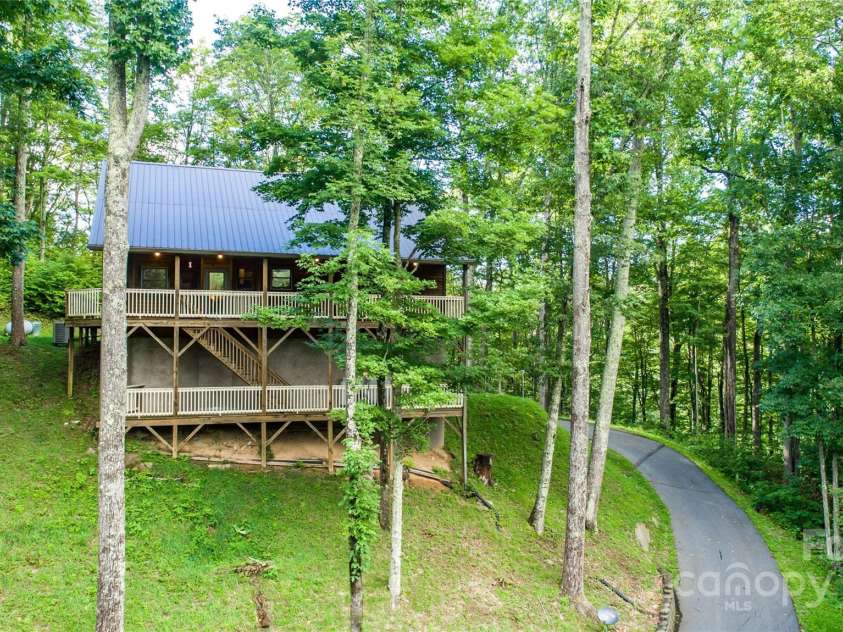 70 Double Back Lane, Mars Hill, NC 28754.  MLS# CAR4304443, YatesRealty ID 2519. Nestled in The Woods