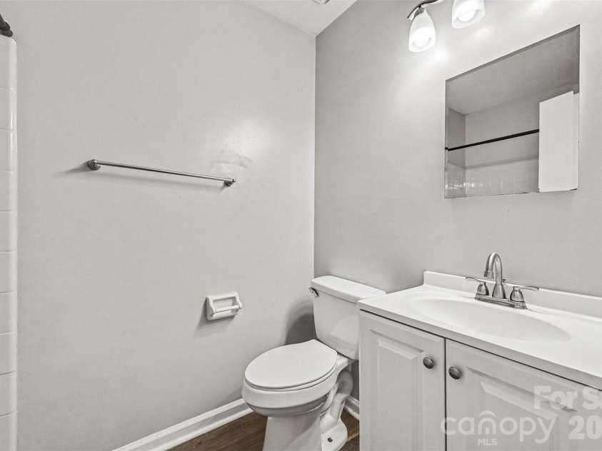 6165 Meadow Rose Lane, Charlotte, NC 28215.  MLS# CAR4406012, YatesRealty ID 25191. The second bath features a vanity with solid surface sink and more...
