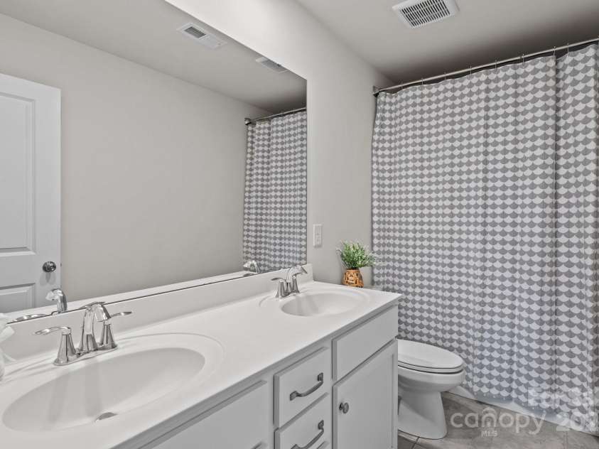 169 Rooster Tail Lane, Troutman, NC 28166.  MLS# CAR4272207, YatesRealty ID 25193. Hall bathroom on the second floor