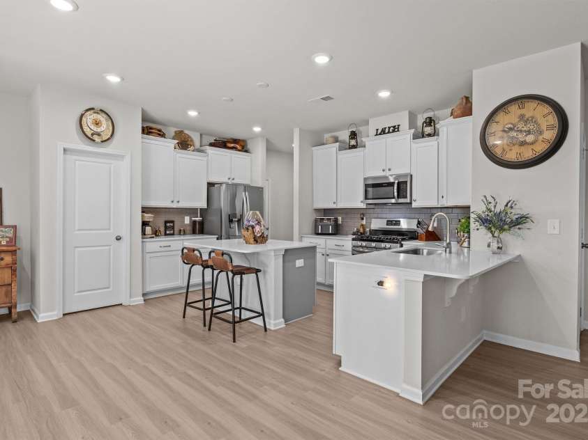 169 Rooster Tail Lane, Troutman, NC 28166.  MLS# CAR4272207, YatesRealty ID 25193. Roomy kitchen with quartz countertops
