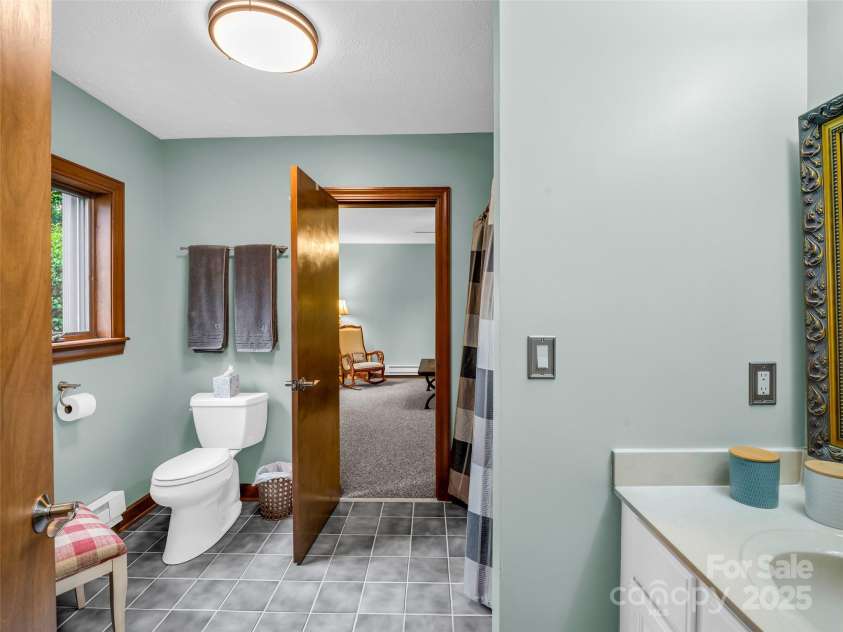 11 Bannerwood Drive, Horse Shoe, NC 28742.  MLS# CAR4257161, YatesRealty ID 25194. Additional Bathroom in Basement