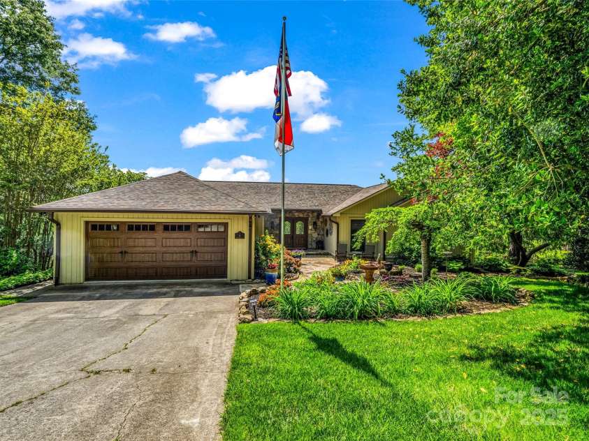 11 Bannerwood Drive, Horse Shoe, NC 28742.  MLS# CAR4257161, YatesRealty ID 25194. Driveway entering 2 car garage_Main level entry