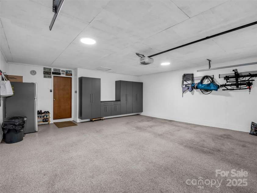 11 Bannerwood Drive, Horse Shoe, NC 28742.  MLS# CAR4257161, YatesRealty ID 25194. Garage with shelving and epoxy flooring