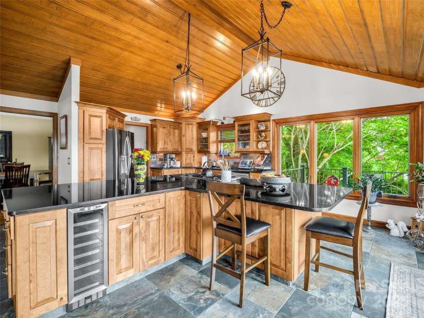 11 Bannerwood Drive, Horse Shoe, NC 28742.  MLS# CAR4257161, YatesRealty ID 25194. Kitchen with vaulted ceilings