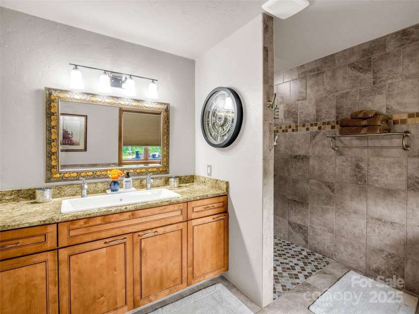 11 Bannerwood Drive, Horse Shoe, NC 28742.  MLS# CAR4257161, YatesRealty ID 25194. Primary Bathroom