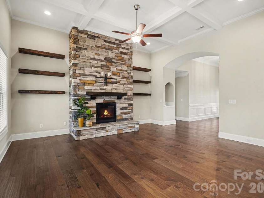 10885 Greenvale Drive, Harrisburg, NC 28075.  MLS# CAR4356120, YatesRealty ID 25209. Living room with coffered ceiling