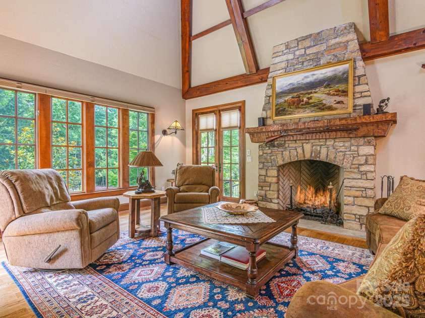176 Valley Springs Road, Asheville, NC 28803.  MLS# CAR4277754, YatesRealty ID 25216. Classic Stone Fireplace with Carved Mantel