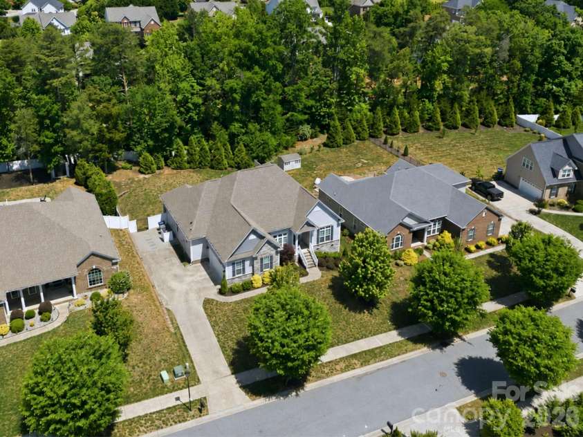 4198 Abernathy Place, Harrisburg, NC 28075.  MLS# CAR4378263, YatesRealty ID 25218. Tree-lined Backyard