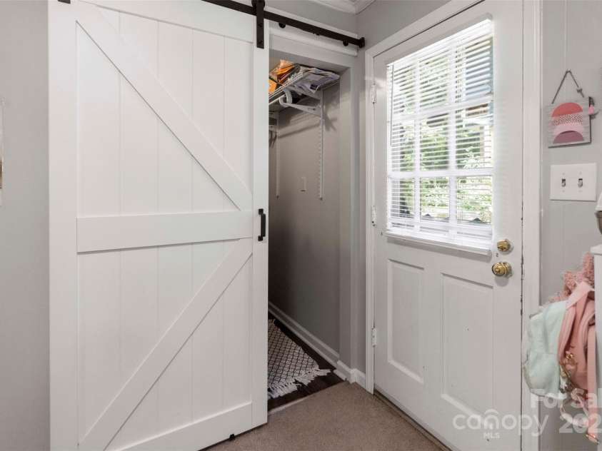 10108 Starwood Drive, Charlotte, NC 28215.  MLS# CAR4277537, YatesRealty ID 25221. Side door that goes out to the driveway and this pic also features the large walk in closet in this 4th bedroom