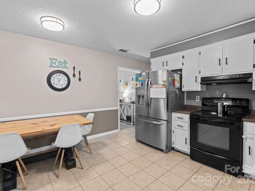 10108 Starwood Drive, Charlotte, NC 28215.  MLS# CAR4277537, YatesRealty ID 25221. View from the back door looking into the kitchen. So much space in this kitchen you could put in a kitchen island, if needed.