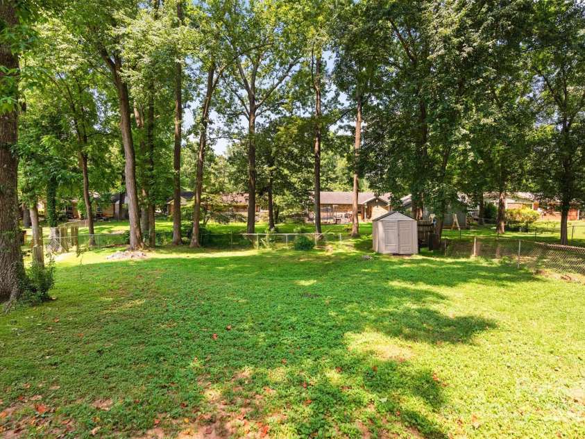 10108 Starwood Drive, Charlotte, NC 28215.  MLS# CAR4277537, YatesRealty ID 25221. View from the back door over looking the back yard (all playground items have been removed for purpose of showing the large yard).