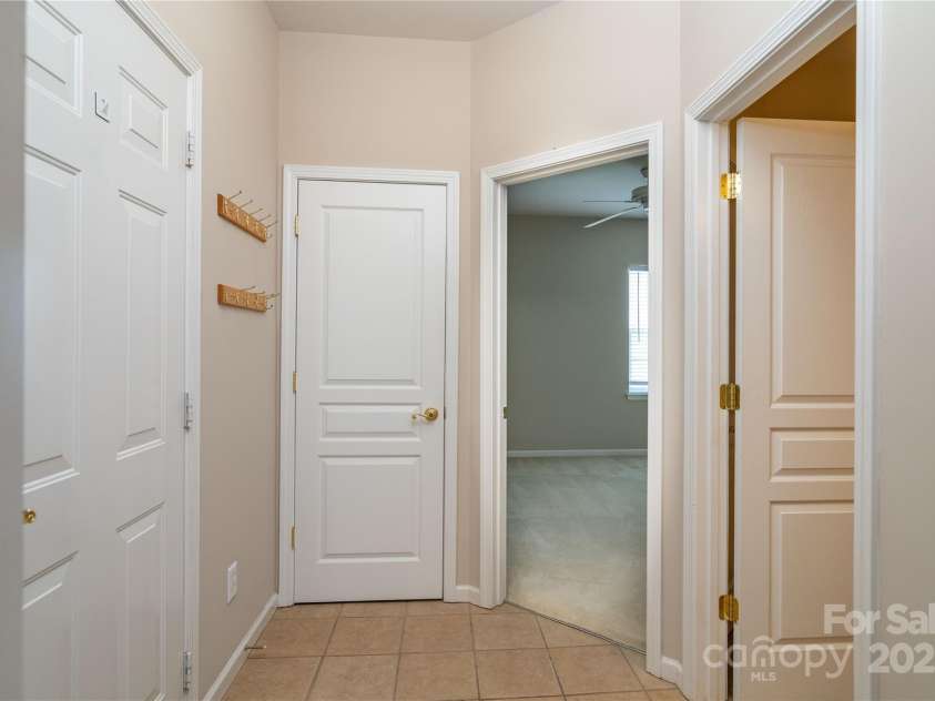 9514 Kestral Ridge Drive, Charlotte, NC 28269.  MLS# CAR4279502, YatesRealty ID 25222. Hall at garage