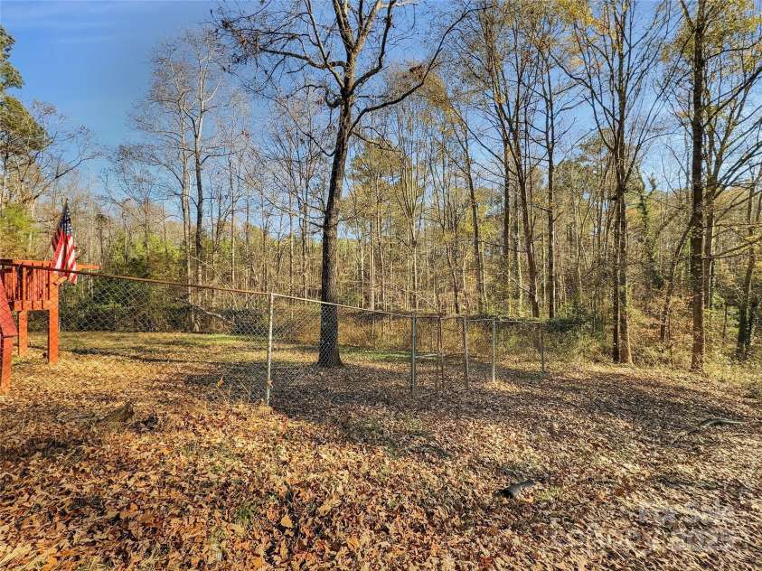 3215 Shadybark Trail, Catawba, SC 29704.  MLS# CAR4329918, YatesRealty ID 25226. Fenced front yard and more woods for great privacy