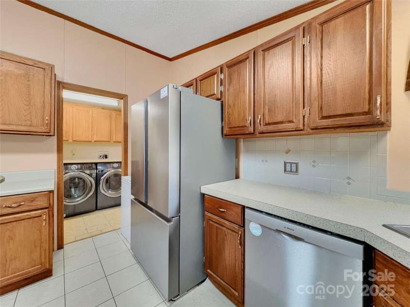 3215 Shadybark Trail, Catawba, SC 29704.  MLS# CAR4329918, YatesRealty ID 25226. Laundry room off of the kitchen