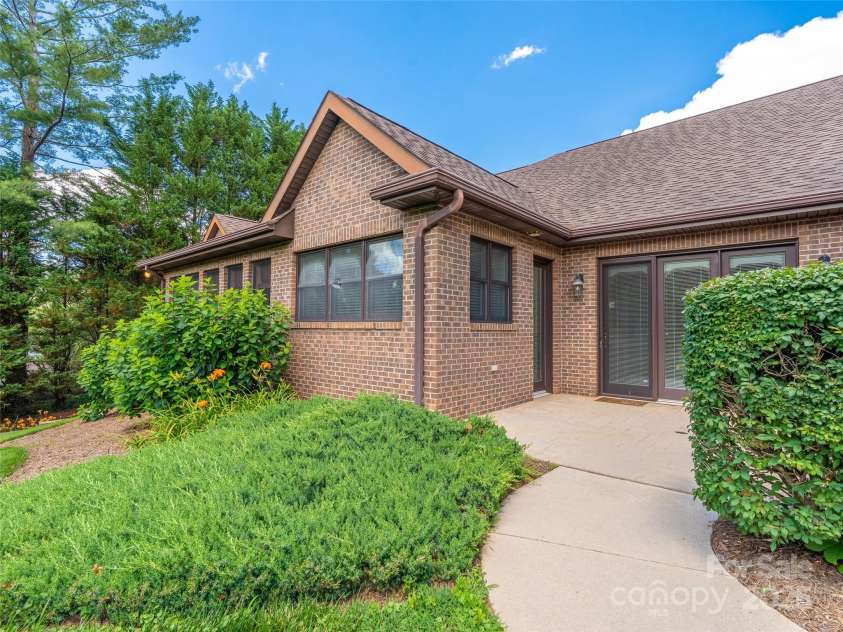 5 Reynolds Place, Asheville, NC 28804.  MLS# CAR4243705, YatesRealty ID 25235. Access to patio grill area from the driveway