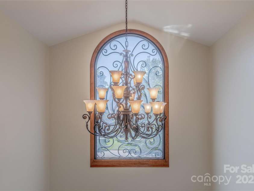 3100 Shady Grove Lane, Matthews, NC 28104.  MLS# CAR4278146, YatesRealty ID 25238. Chandelier with automated lowering pulley for cleaning