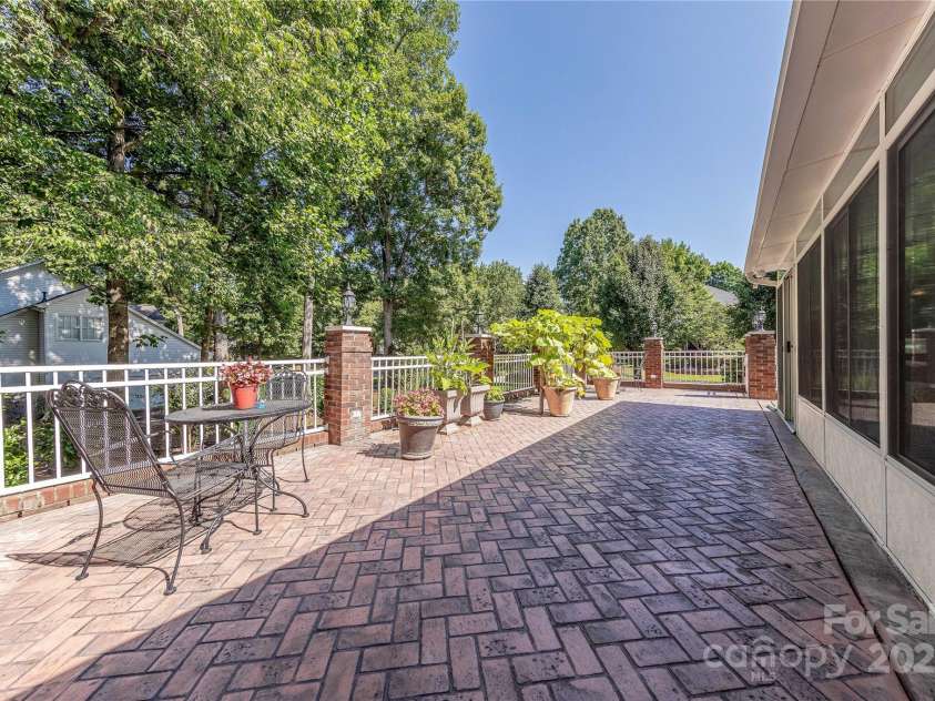 3100 Shady Grove Lane, Matthews, NC 28104.  MLS# CAR4278146, YatesRealty ID 25238. Tiled porch outside sunroom