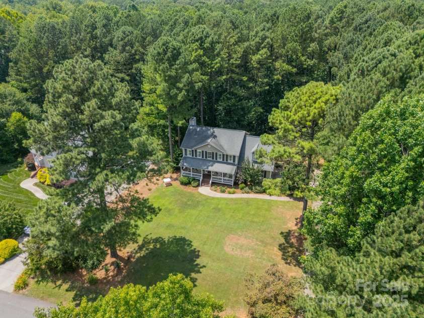 1594 High Ridge Drive, Stanley, NC 28164.  MLS# CAR4279439, YatesRealty ID 25239. The Home is on a large Lot of .85 acres with a wooded, private backyard