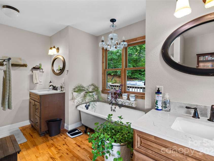 219 Sandalwood Drive, Whittier, NC 28789.  MLS# CAR4255681, YatesRealty ID 25244. Beautiful master bath; cast iron claw footSoaking tub AND a walk in tile shower as well.