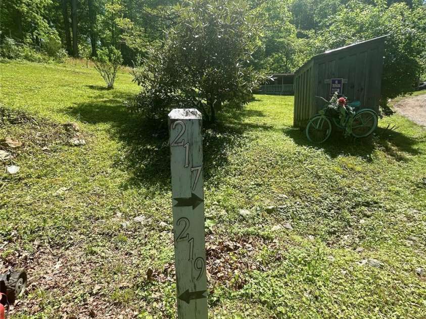 219 Sandalwood Drive, Whittier, NC 28789.  MLS# CAR4255681, YatesRealty ID 25244. Guest house , 217  main home 219