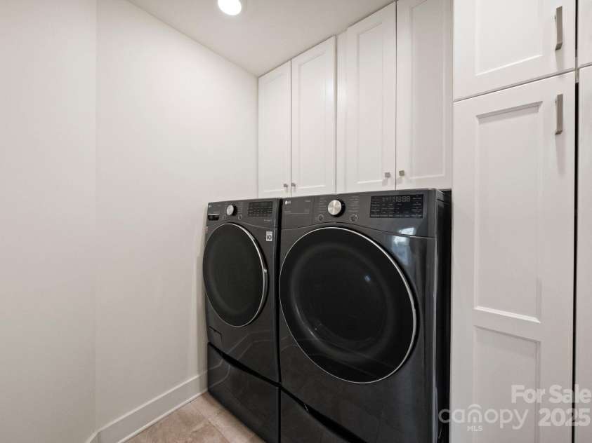619 R L Stowe Road, Belmont, NC 28012.  MLS# CAR4329800, YatesRealty ID 25251. Laundry room with custom cabinetry