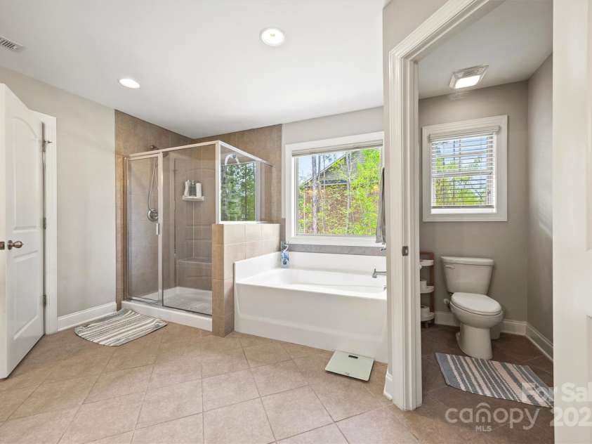 3095 Foggy Hollow Lane, Clover, SC 29710.  MLS# CAR4243248, YatesRealty ID 25252. Primary bathroom with large tile shower and garden tub