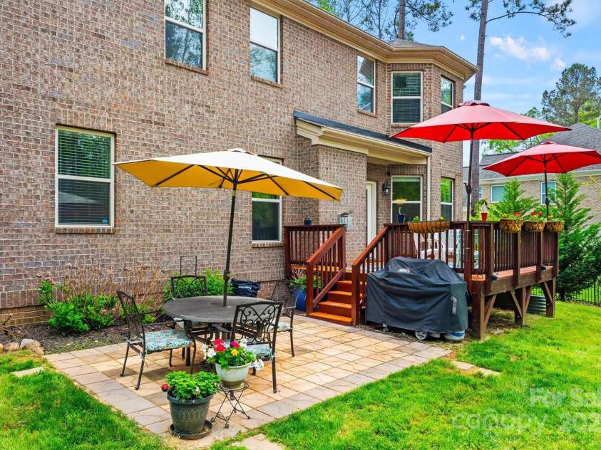 3095 Foggy Hollow Lane, Clover, SC 29710.  MLS# CAR4243248, YatesRealty ID 25252. Rear deck and patio with mature landscaping