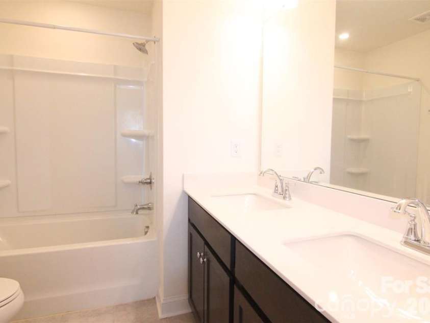 1075 South Point Road, Belmont, NC 28012.  MLS# CAR4351165, YatesRealty ID 2526. Full bath for guests with dual vanity