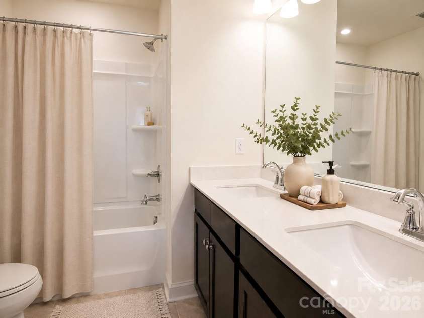 1075 South Point Road, Belmont, NC 28012.  MLS# CAR4351165, YatesRealty ID 2526. Virtually Staged full bath with dual vanity.