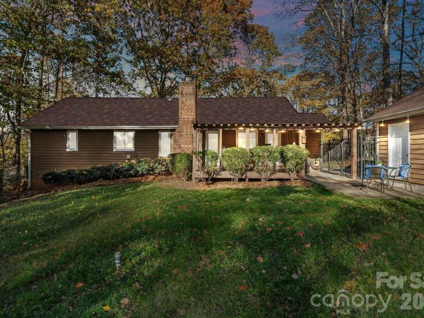 9525 Goldsmith Lane, Mint Hill, NC 28227.  MLS# CAR4333829, YatesRealty ID 2526. Twilight Rear Exterior