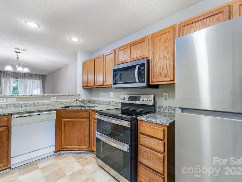 10223 Reindeer Way Lane, Charlotte, NC 28216.  MLS# CAR4268140, YatesRealty ID 25261. New fridge, new microwave and double oven range that has an air fryer feature