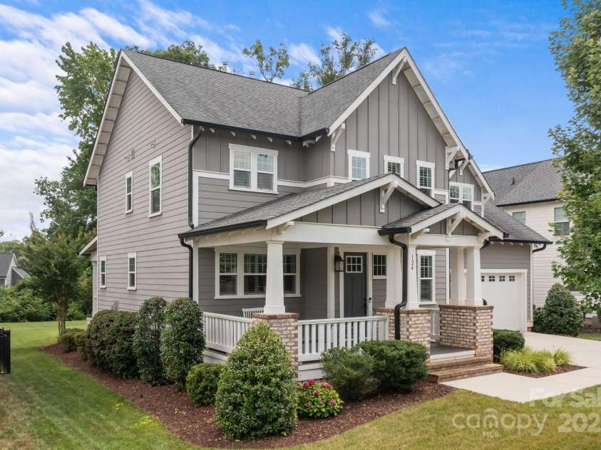 124 Slocumb Lane, Mooresville, NC 28117.  MLS# CAR4271314, YatesRealty ID 25265. Large front porch