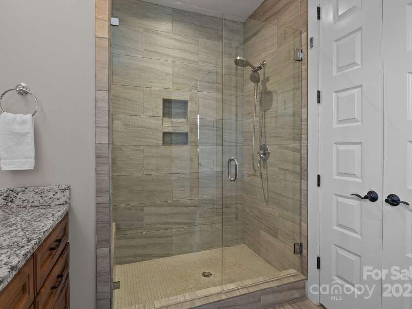 124 Slocumb Lane, Mooresville, NC 28117.  MLS# CAR4271314, YatesRealty ID 25265. Large walk in shower