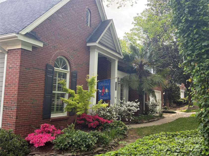3813 Beauvista Drive, Charlotte, NC 28269.  MLS# CAR4275235, YatesRealty ID 25268. Another view of the front while the azaleas were in bloom!