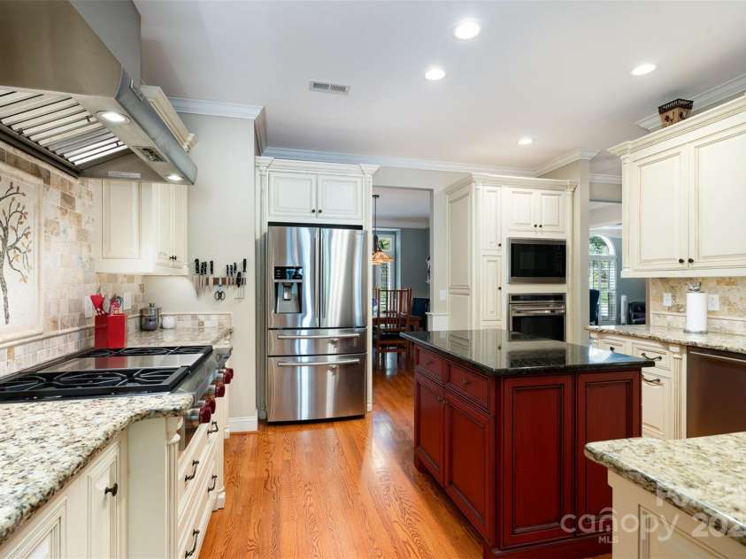 3813 Beauvista Drive, Charlotte, NC 28269.  MLS# CAR4275235, YatesRealty ID 25268. Chefs kitchen with island, wolf stove and vent hood