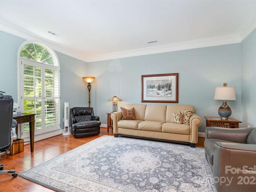 3813 Beauvista Drive, Charlotte, NC 28269.  MLS# CAR4275235, YatesRealty ID 25268. Formal living room/den in the front of the house with plantation shutters and a transom window!