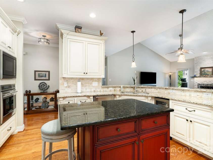3813 Beauvista Drive, Charlotte, NC 28269.  MLS# CAR4275235, YatesRealty ID 25268. This is a dream kitchen with soft close drawers and cabinets. A spice cabinet with removable spice trays.  There is even a cabinet especially for your cookie sheets