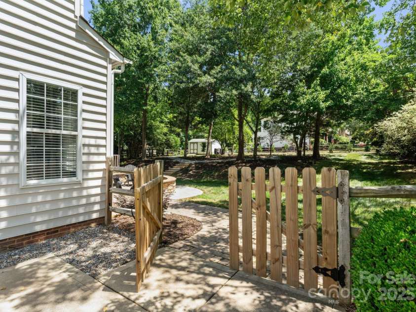 11202 Mountain Pine Drive, Charlotte, NC 28214.  MLS# CAR4273710, YatesRealty ID 25269. Fully Fenced 1/2 acre landscaped backyard