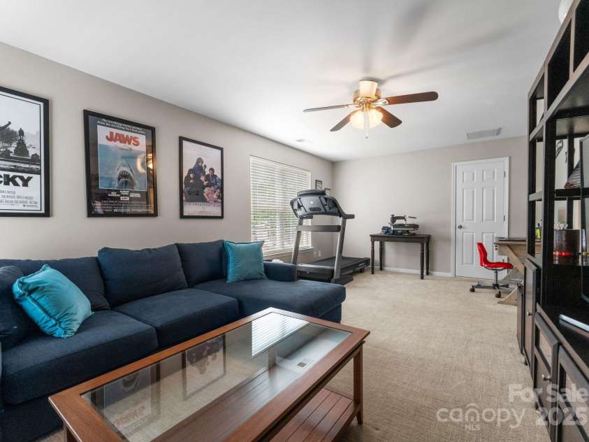 11202 Mountain Pine Drive, Charlotte, NC 28214.  MLS# CAR4273710, YatesRealty ID 25269. Perfect for Movie Night and Working Out