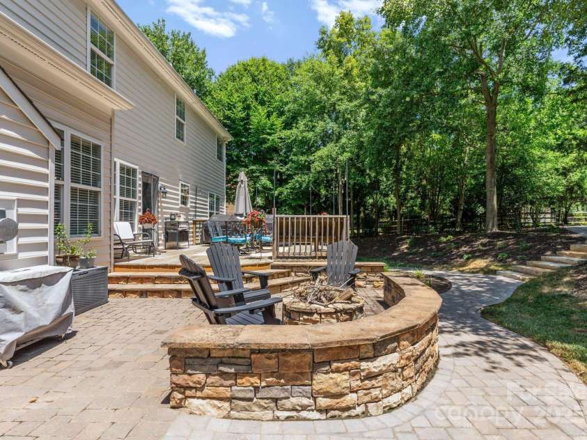 11202 Mountain Pine Drive, Charlotte, NC 28214.  MLS# CAR4273710, YatesRealty ID 25269. Stone Firepit perfect for s'mores and stories