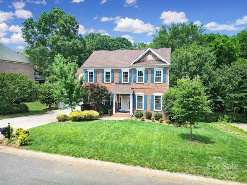 1201 Beckford Glen Drive, Waxhaw, NC 28173.  MLS# CAR4266155, YatesRealty ID 25279. Beautiful Four Bedroom PLUS Main Level Office PLUS Bonus Room, 2.5 Bath Home on Almost Half an Acre in Sought-After Amenity-Filled Hunter Oaks! Three-Side Brick with Fiber Cement at Back.