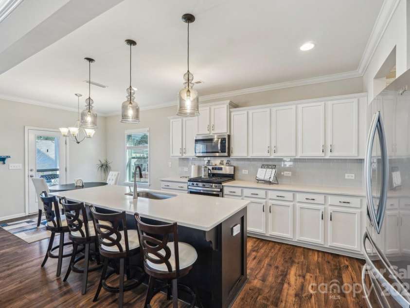 1426 Whitman Court, York, SC 29745.  MLS# CAR4227573, YatesRealty ID 2528. Beautiful white cabinetry with black island
