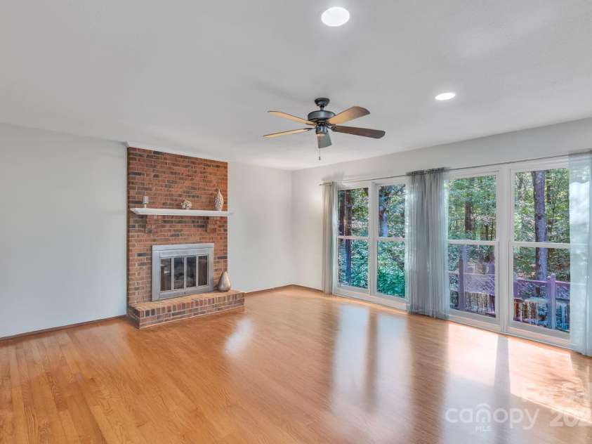 5024 Ardenwoods Drive, Charlotte, NC 28215.  MLS# CAR4278121, YatesRealty ID 25289. Family Room with view of wooded lot 1 (no furniture)
