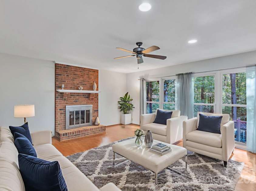 5024 Ardenwoods Drive, Charlotte, NC 28215.  MLS# CAR4278121, YatesRealty ID 25289. Family Room with view of wooded lot 2 (w/ furniture)