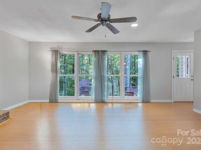 5024 Ardenwoods Drive, Charlotte, NC 28215.  MLS# CAR4278121, YatesRealty ID 25289. Family Room with view of wooded lot  (no furniture)