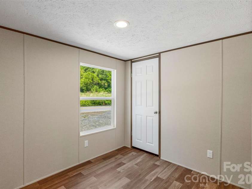 265 Curtis Creek Road, Candler, NC 28715.  MLS# CAR4373081, YatesRealty ID 25291. 