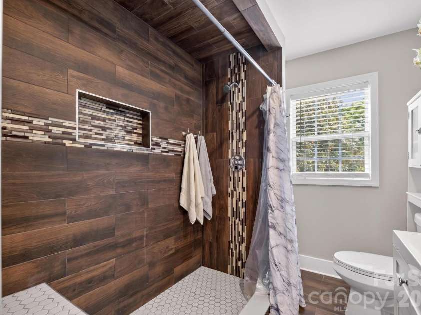2076 Connelly Springs Road, Lenoir, NC 28645.  MLS# CAR4380178, YatesRealty ID 25293. Shower with custom accent details 