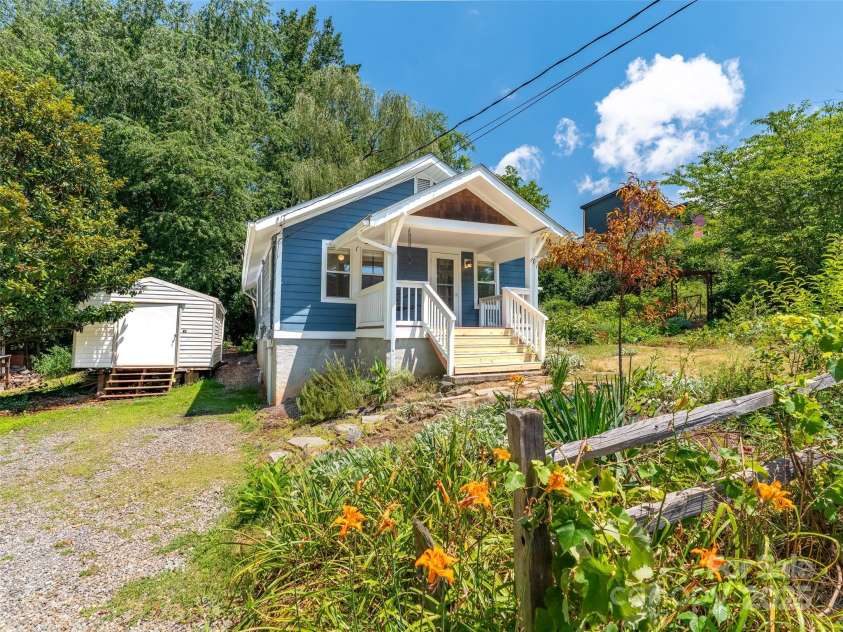83 5th Avenue, Asheville, NC 28806.  MLS# CAR4275954, YatesRealty ID 25294. Property has off street parking and large, dry storage shed.