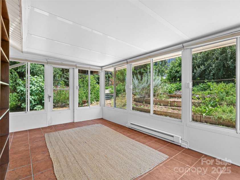 83 5th Avenue, Asheville, NC 28806.  MLS# CAR4275954, YatesRealty ID 25294. See every season from the sunroom.