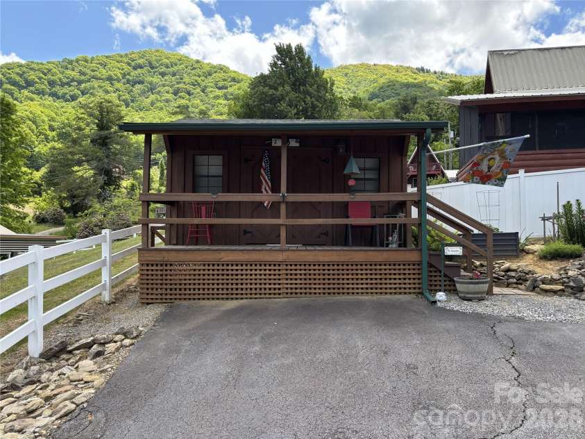 361 Black Camp Gap Road, Maggie Valley, NC 28751.  MLS# CAR4383045, YatesRealty ID 25299. Shed 16' x 10' with covered deck.
